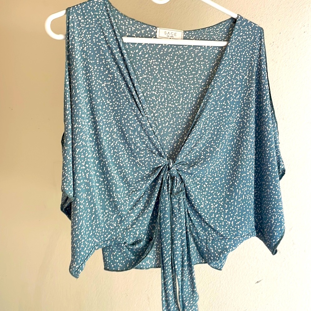 Perfect blue crop top with cut out sleeves and tie in the front!